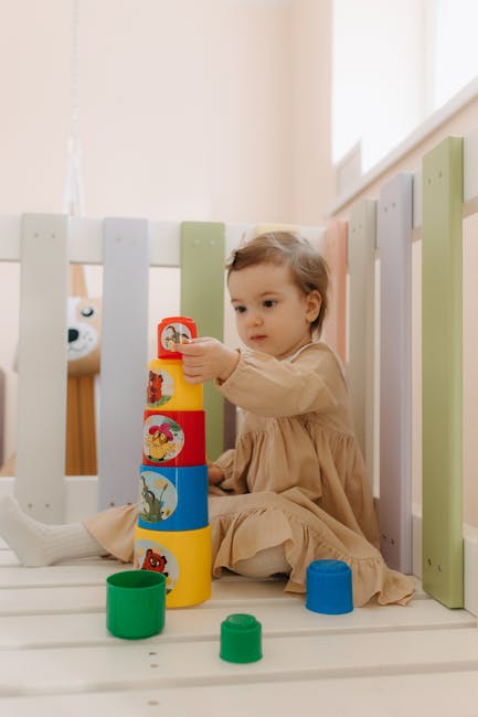 A young child concentrates while using a wooden shape sorter.