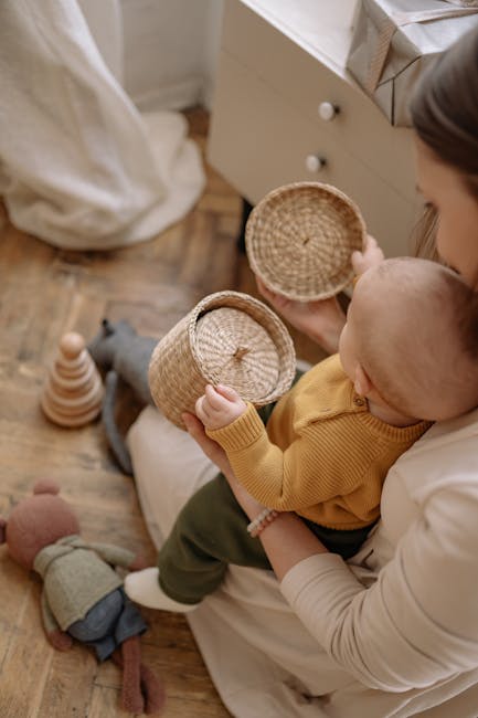 Infant exploring textures on a soft activity cube.