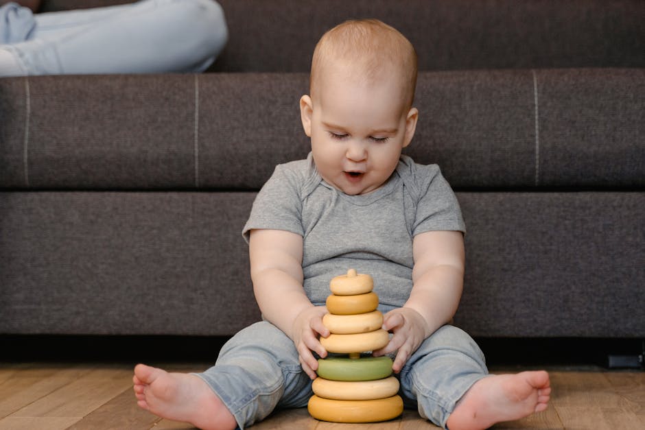 Child using a shape sorter to develop fine motor skills.